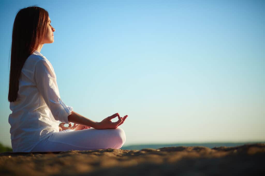 Meditating woman reducing stress